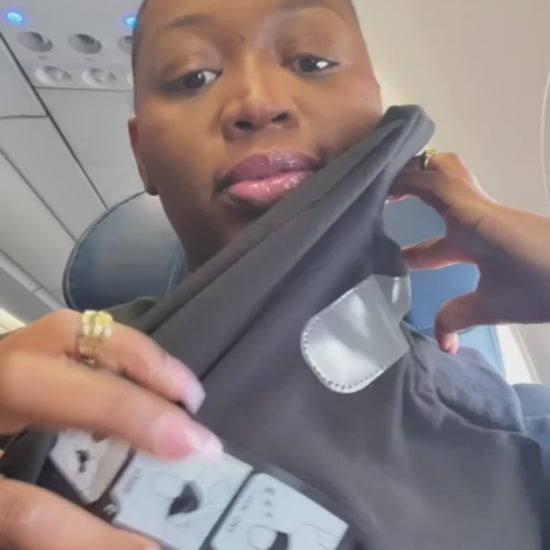 Customer using the Solvira travel pillow on a plane